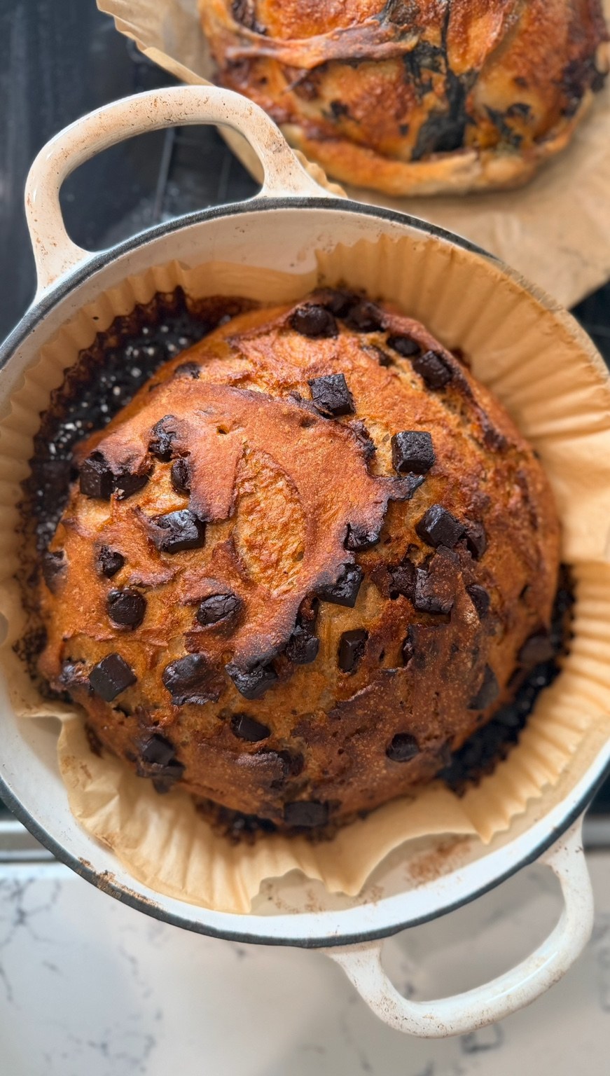 Chocolate-studded bread baked in a parchment-lined Dutch oven
